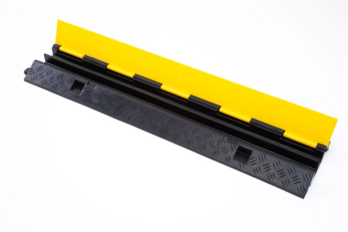 Black and yellow floor cable protector 