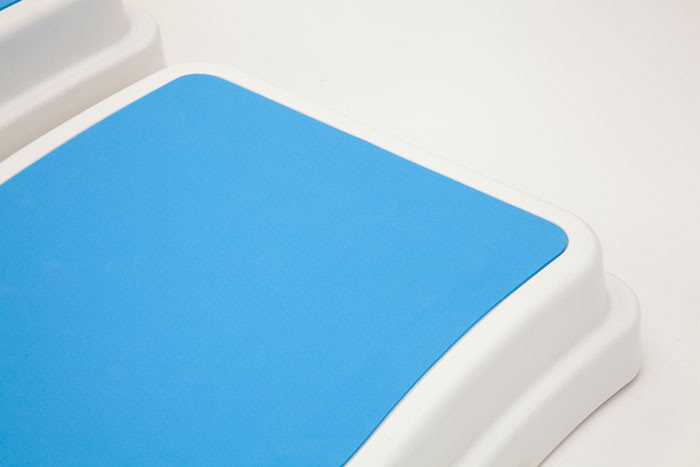 Close up of the blue non slip surface on the plastic bath step